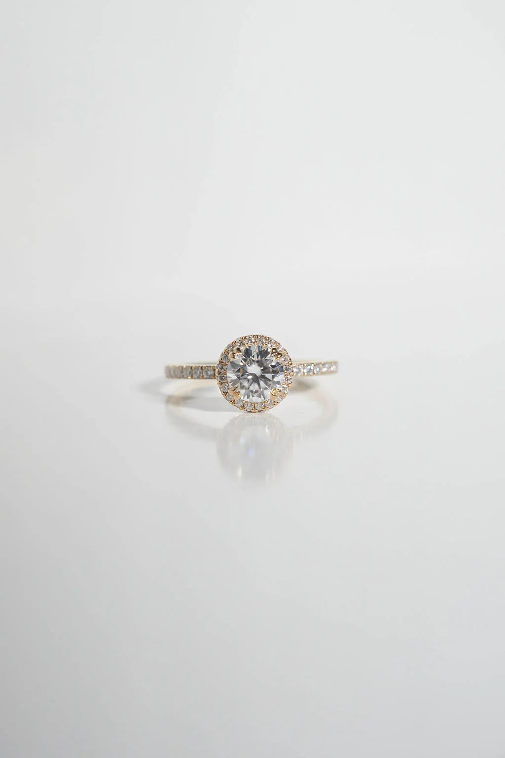 Moissanite ring on a light gray background