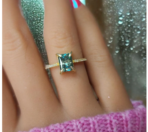 This Stunning Radiant cut Blue Green Moissanite Solitaire Ring
