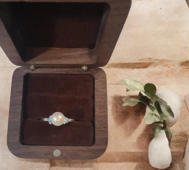 Elegant sterling silver ring featuring a large, lustrous 8mm freshwater pearl as its centerpiece