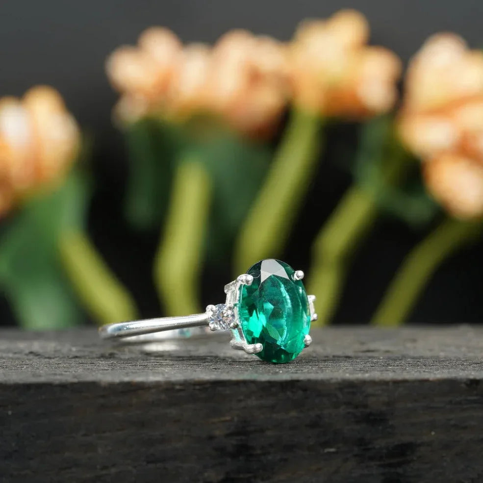 Oval Cut Emerald & Zirconia Three Stone Engagement Ring - Gigiscc