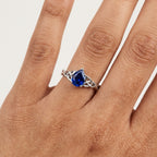 Pear-Shaped Blue Sapphire Celtic Knot Engagement Ring With Hand