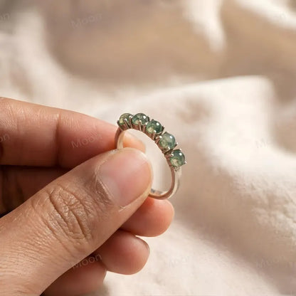Moss Agate Wedding Band featuring five round-cut moss agate stones in a silver setting.