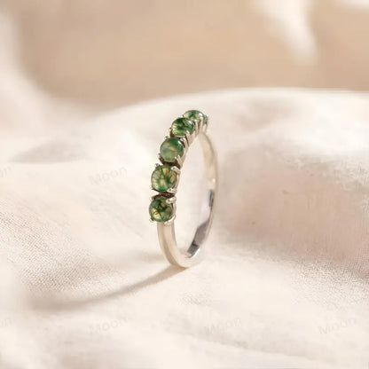 Moss Agate Wedding Band featuring five round-cut moss agate stones on a silver ring.