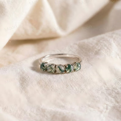 Moss Agate Wedding Band featuring five round-cut moss agate stones in a silver setting.