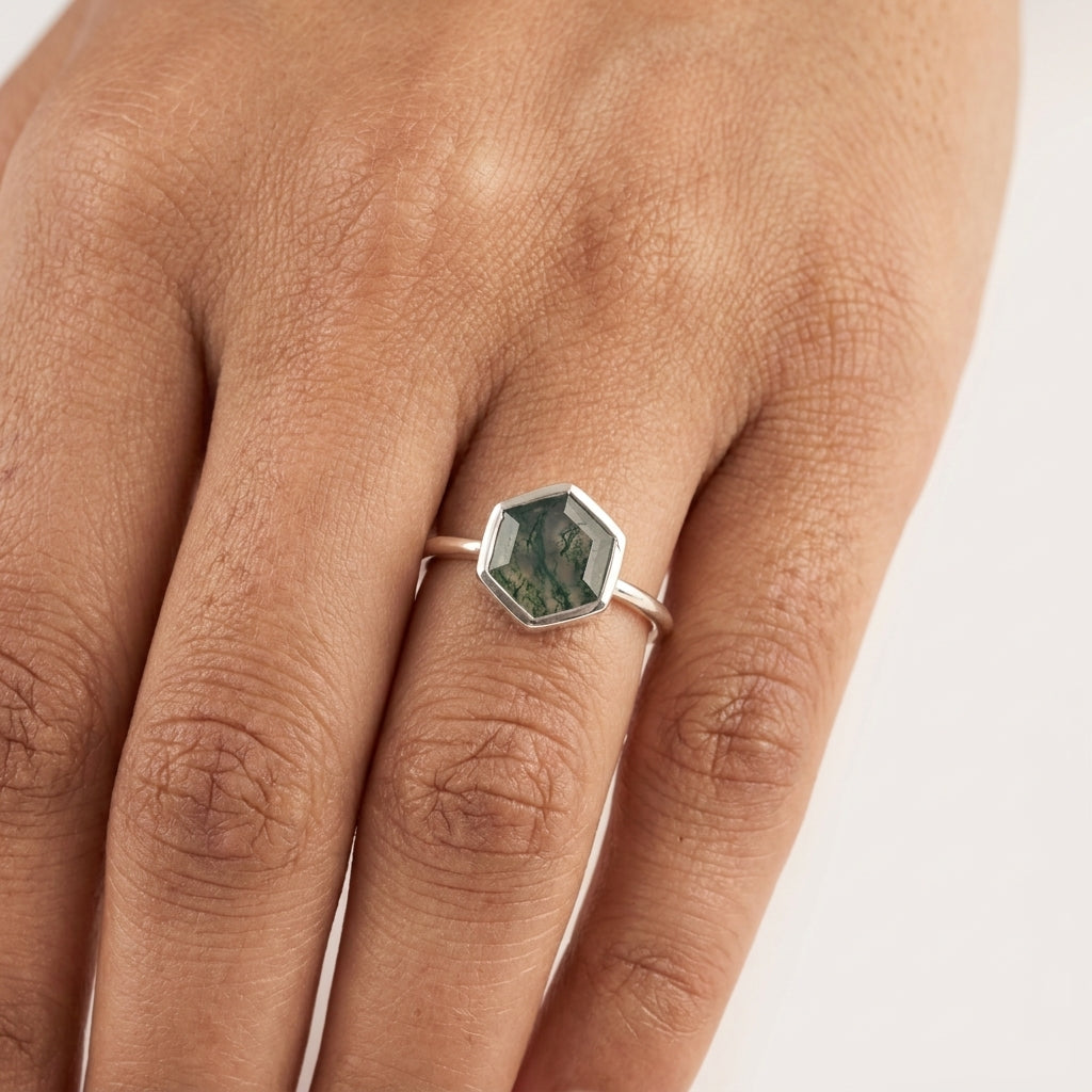 Hexagon Cut Moss Agate Bezel Set Engagement Ring with model hand