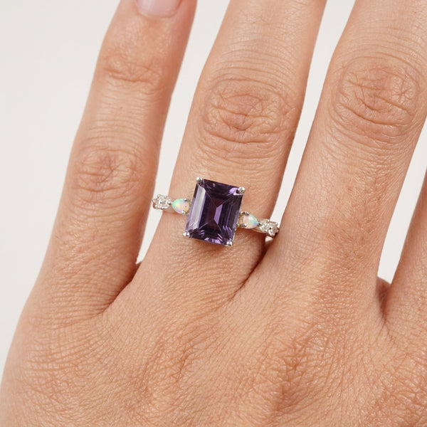 Emerald Cut Alexandrite And Fire Opal Engagement Ring With Model Hand