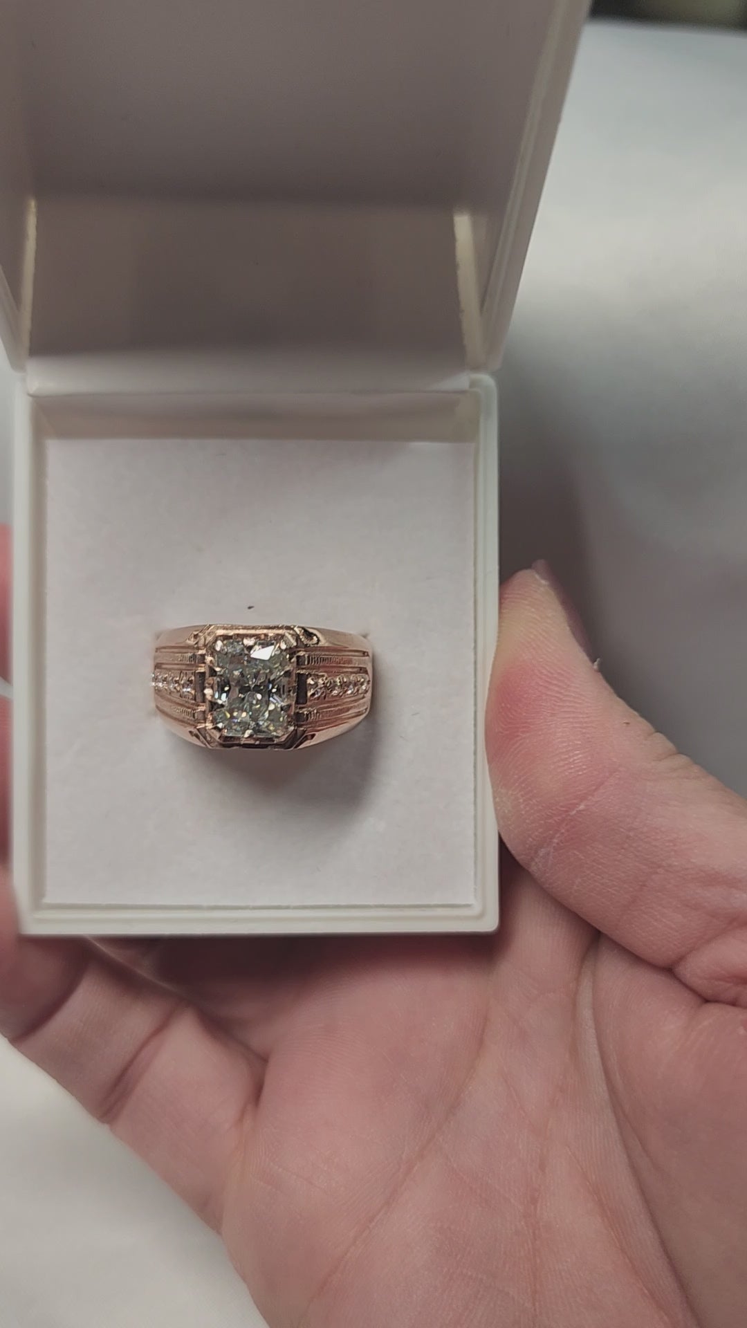 3ct Emerald Cut Moissanite Mens Ring Set in a vintage claw rose gold setting with detailed side stones. For Him. Wedding, Anniversary Ring.