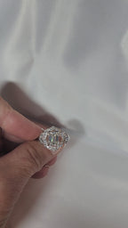 2ct Emerald Cut Moissanite ring enhanced by moissanite halo setting.