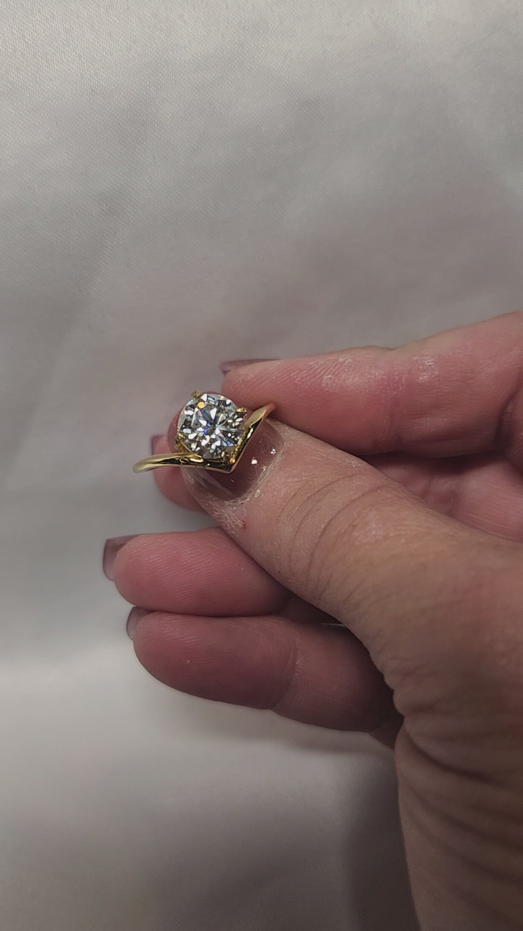 Stunning 2ct Round Brilliant Cut offset Moissanite Solitaire setting.