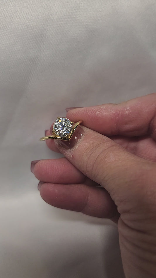 Stunning 2ct Round Brilliant Cut offset Moissanite Solitaire setting.