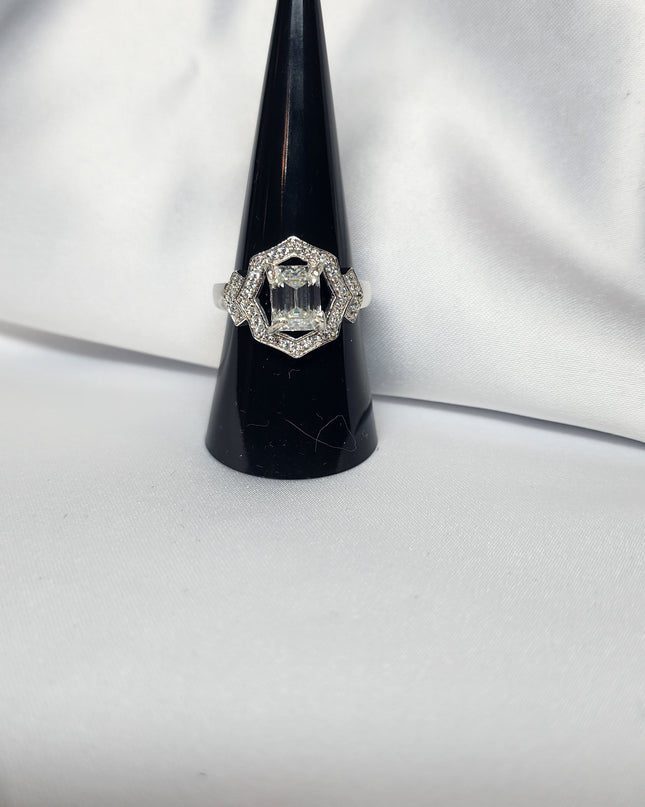 2ct Emerald Cut Moissanite ring enhanced by moissanite halo setting.