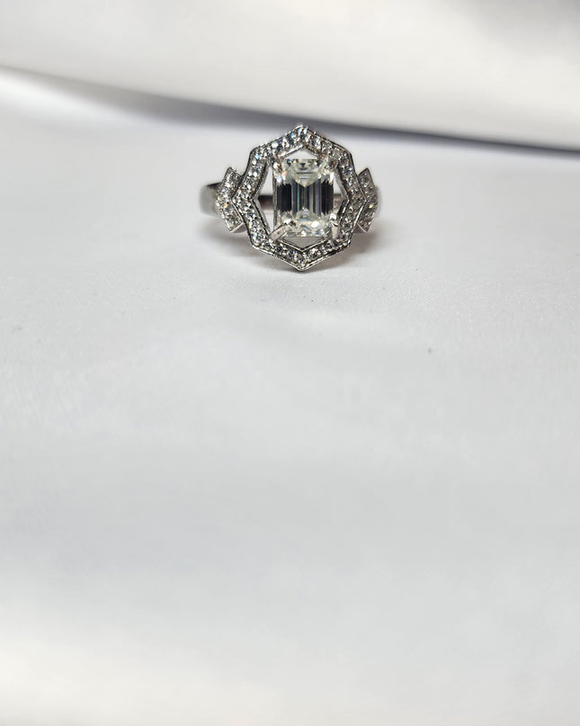 2ct Emerald Cut Moissanite ring enhanced by moissanite halo setting.
