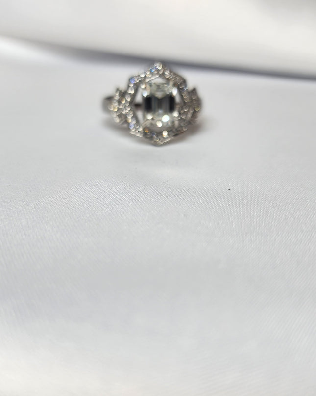 2ct Emerald Cut Moissanite ring enhanced by moissanite halo setting.