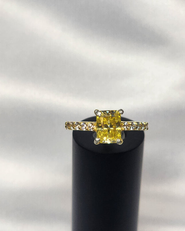 2ct Exquisite Yellow Radiant Cut Moissanite Solitaire Ring. A Timeless Appeal enhanced by moissanite  side stones. GRA Certified, VVS1.