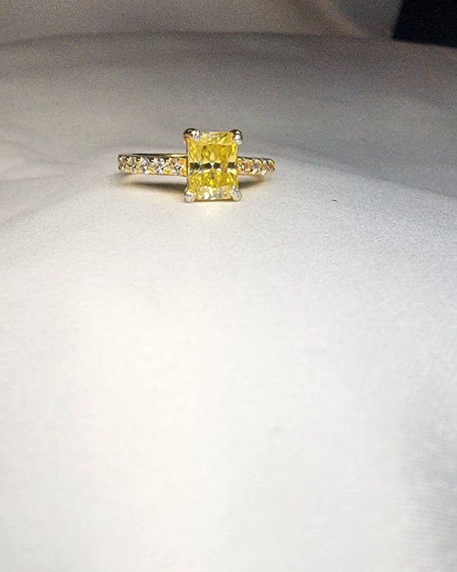 2ct Exquisite Yellow Radiant Cut Moissanite Solitaire Ring. A Timeless Appeal enhanced by moissanite  side stones. GRA Certified, VVS1.