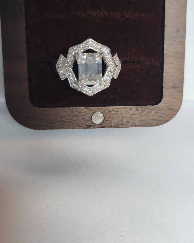 2ct Emerald Cut Moissanite ring enhanced by moissanite halo setting.