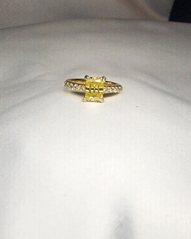 2ct Exquisite Yellow Radiant Cut Moissanite Solitaire Ring. A Timeless Appeal enhanced by moissanite  side stones. GRA Certified, VVS1.
