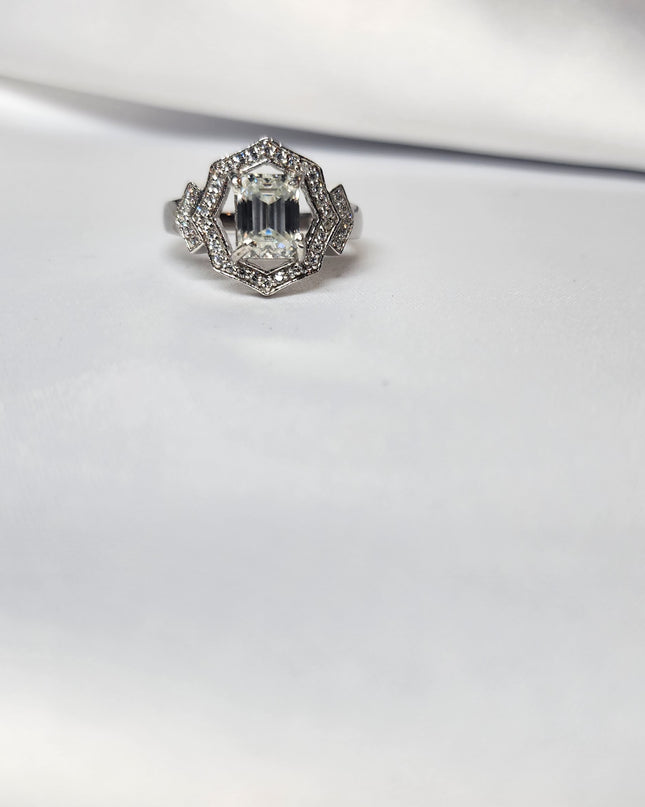 2ct Emerald Cut Moissanite ring enhanced by moissanite halo setting.