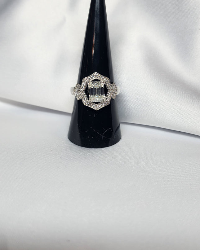 2ct Emerald Cut Moissanite ring enhanced by moissanite halo setting.