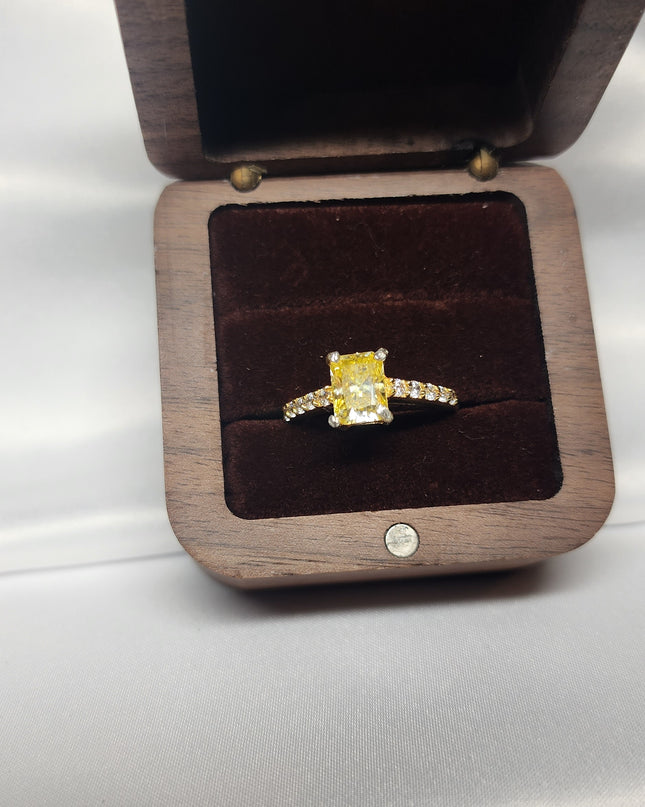 2ct Exquisite Yellow Radiant Cut Moissanite Solitaire Ring. A Timeless Appeal enhanced by moissanite  side stones. GRA Certified, VVS1.