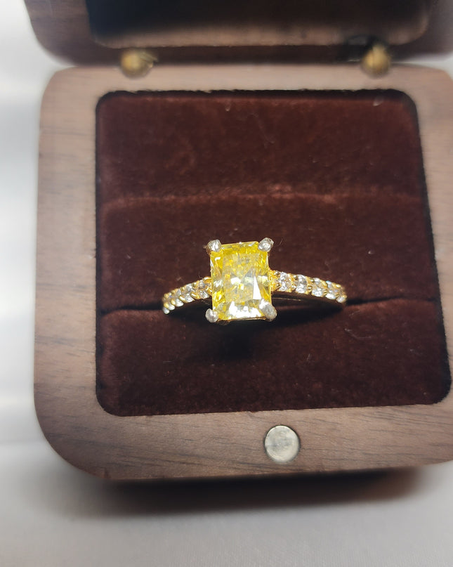 2ct Exquisite Yellow Radiant Cut Moissanite Solitaire Ring. A Timeless Appeal enhanced by moissanite  side stones. GRA Certified, VVS1.